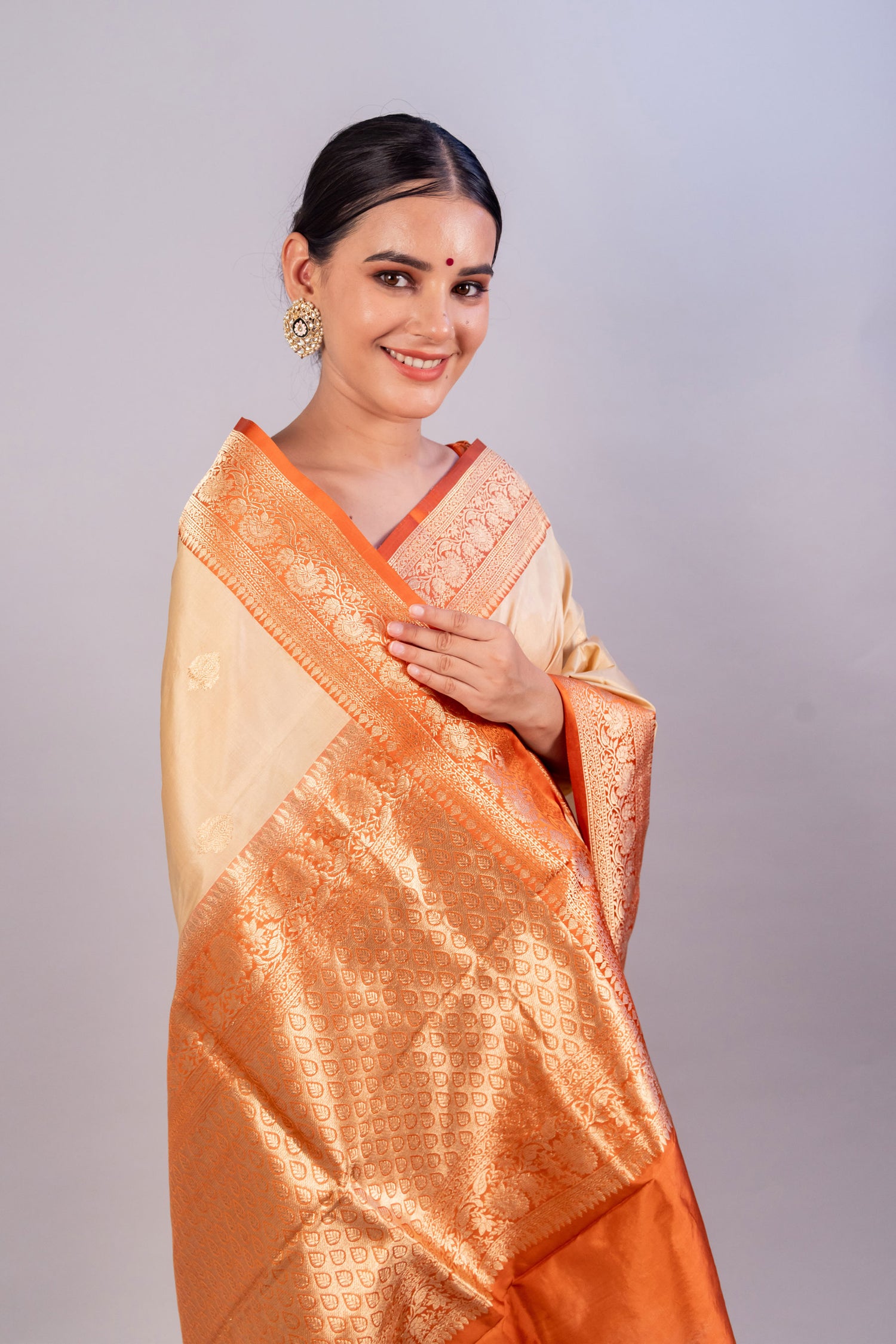 Graceful Beige Pure Katan Silk Handloom Saree with Orange Border